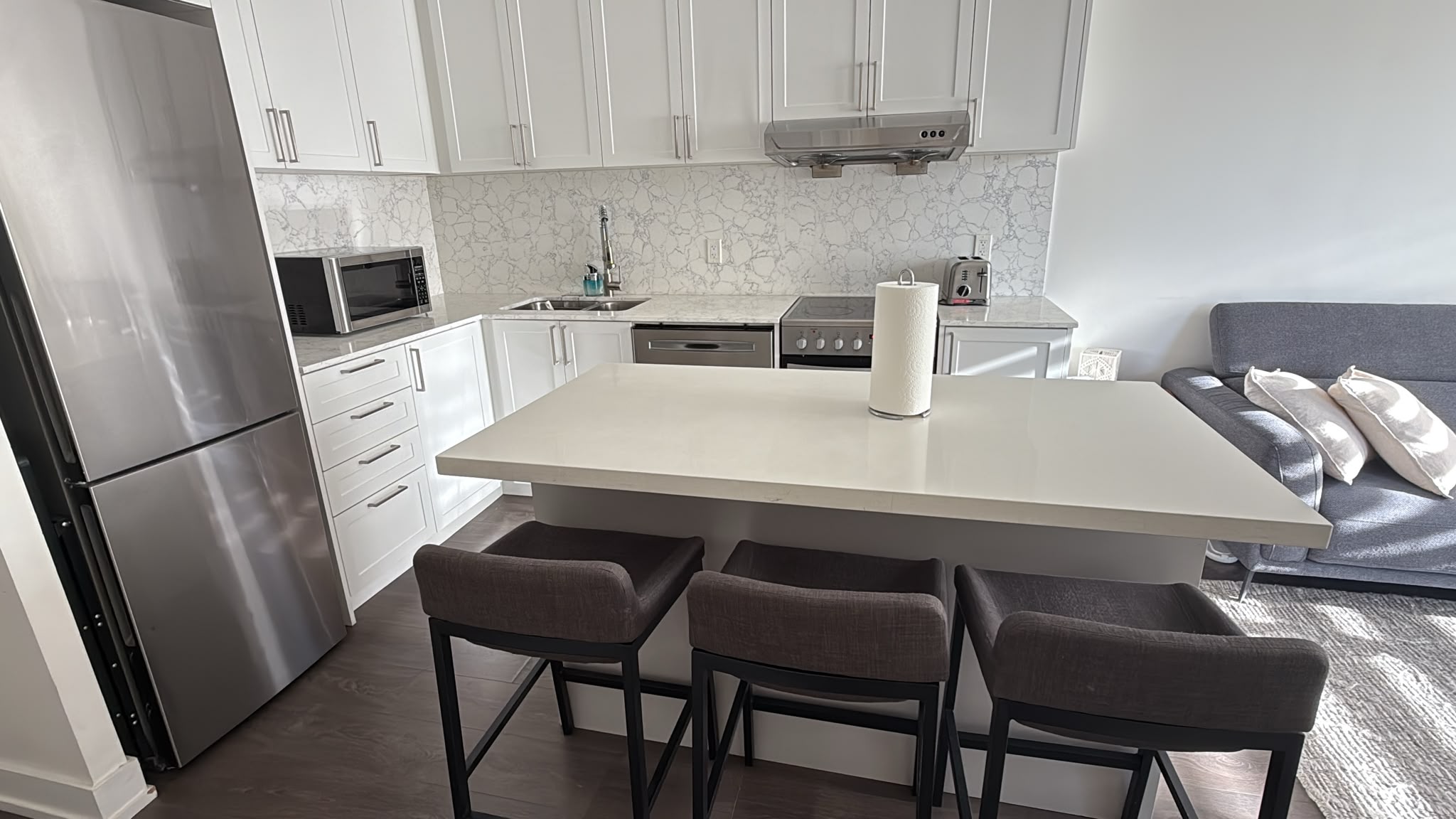 Clean Airbnb kitchen and island ready for the next guest