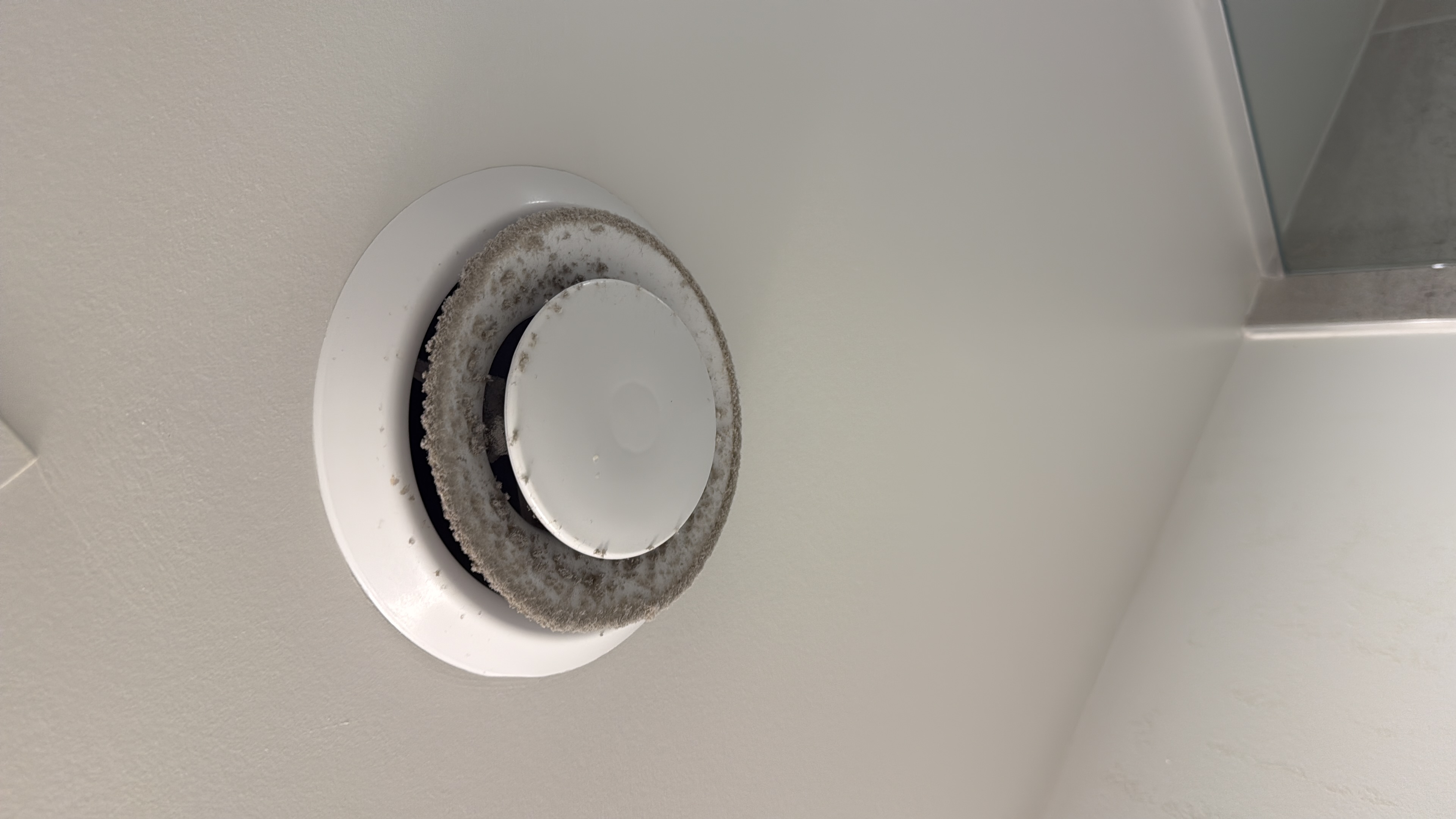 Dust buildup found around a ceiling ventilation cover