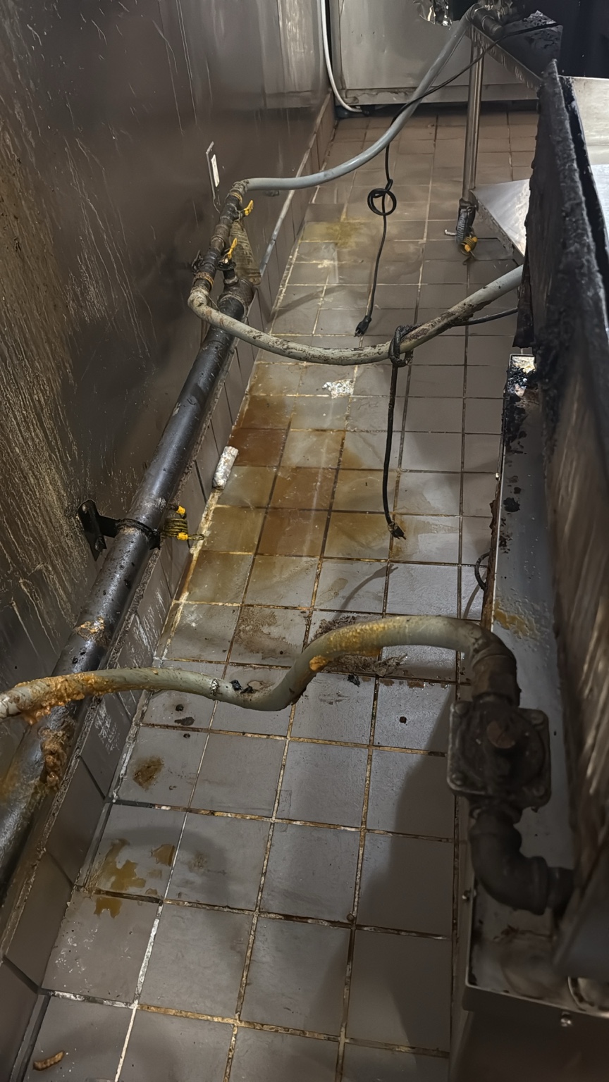 Commercial kitchen floor and grout during deep cleaning