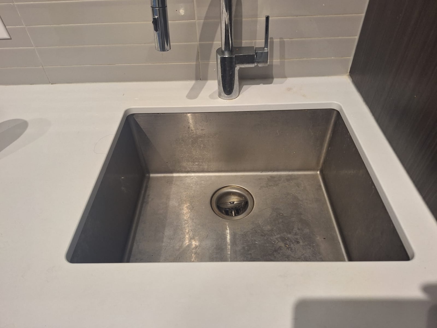 Kitchen sink before move cleaning
